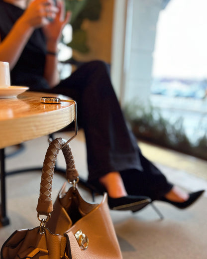 Exclusive purse hanger combining function with timeless design