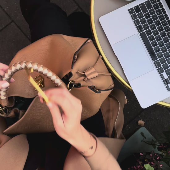 Compact handbag hook that keeps your bag clean and within reach.